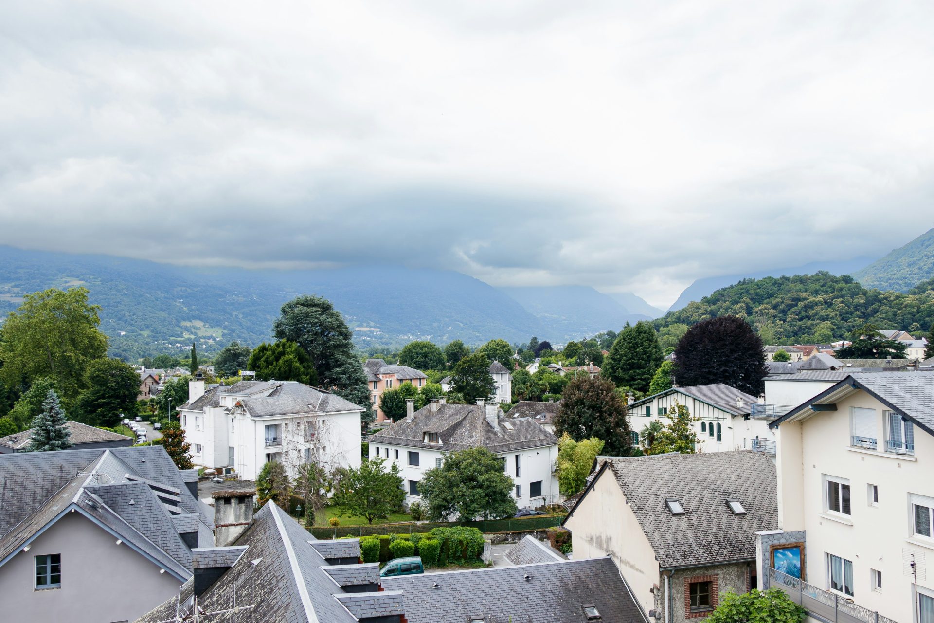 A view of a town with mountains in the background